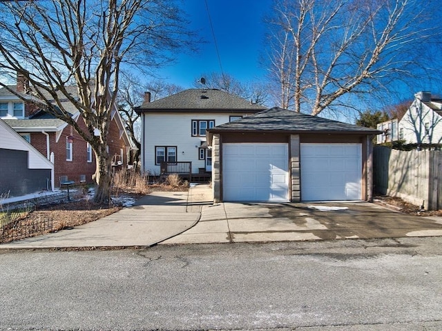 view of front of house with an outdoor structure and a garage