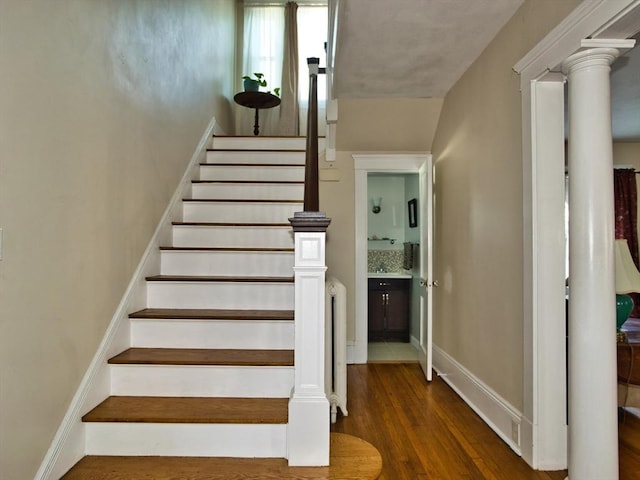 stairway featuring wood-type flooring