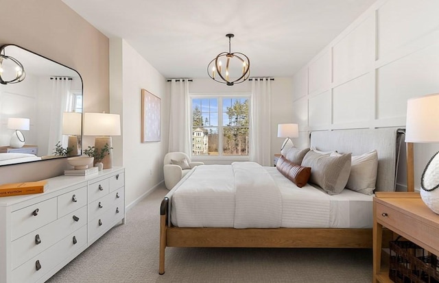 bedroom featuring light colored carpet and an inviting chandelier