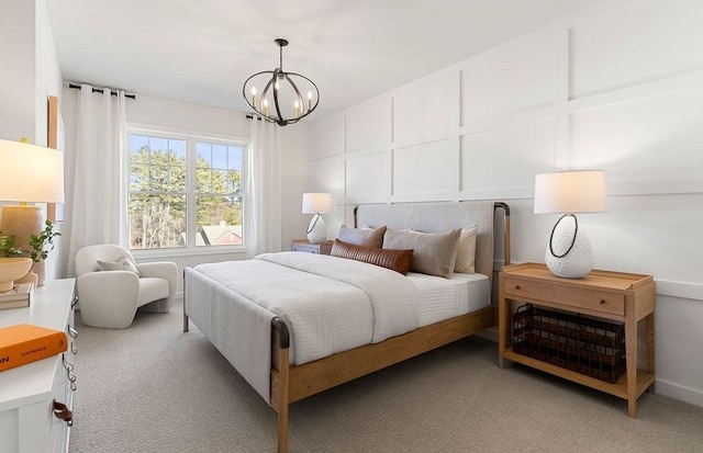 carpeted bedroom with a chandelier