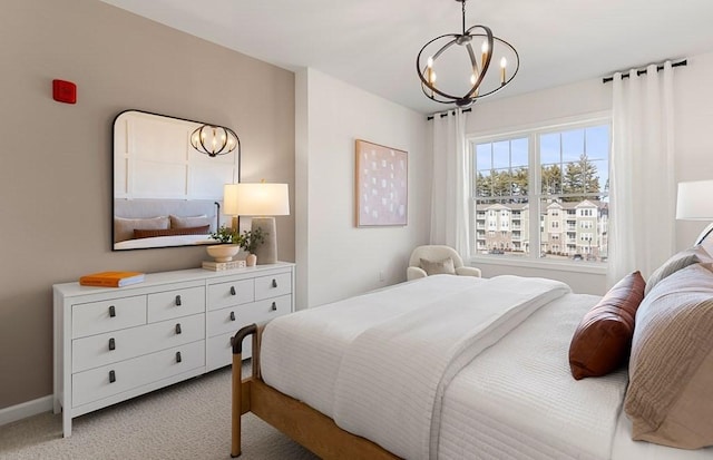 carpeted bedroom with a notable chandelier