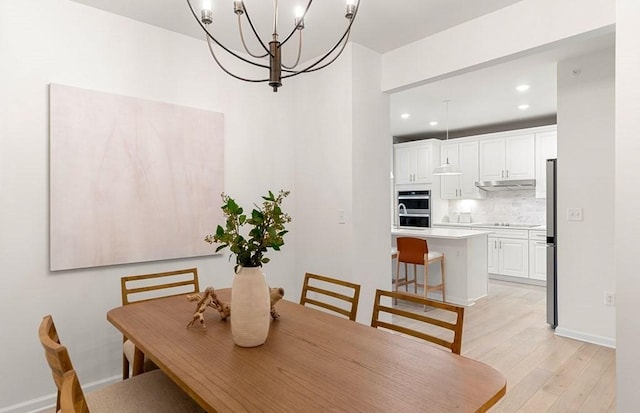 dining area featuring light wood-type flooring