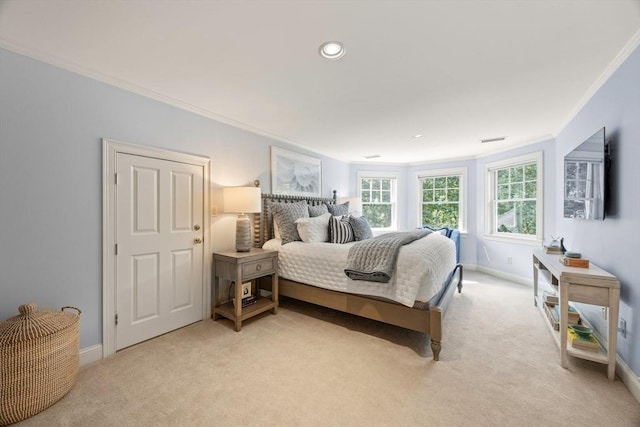 bedroom featuring crown molding and light carpet