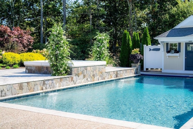 view of swimming pool featuring pool water feature