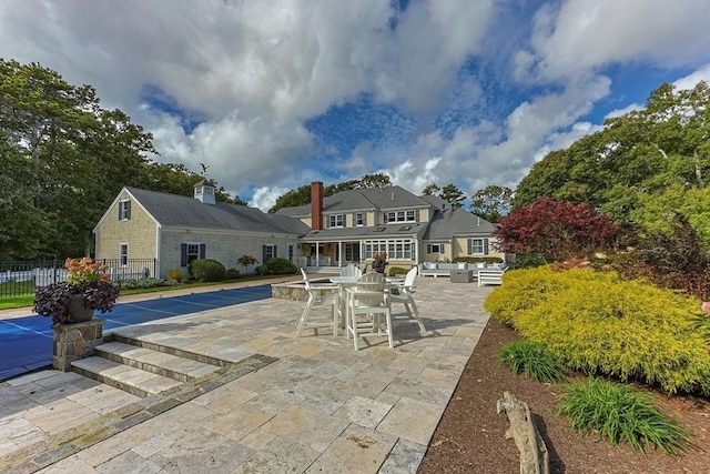 back of house with a patio area