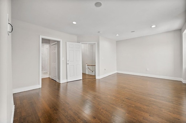 spare room with dark hardwood / wood-style floors