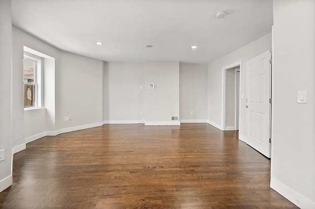 spare room with dark hardwood / wood-style floors