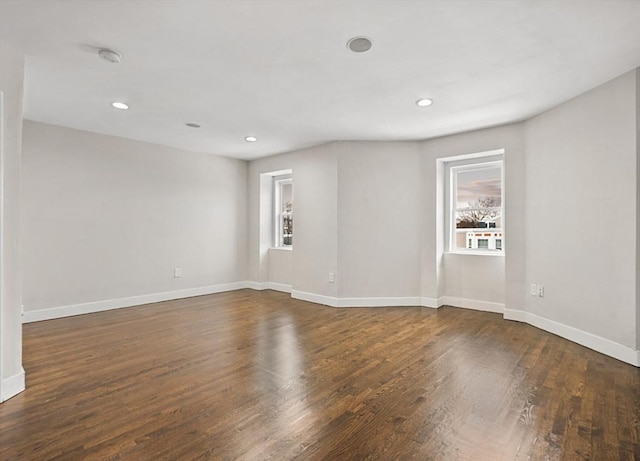 empty room featuring dark hardwood / wood-style flooring