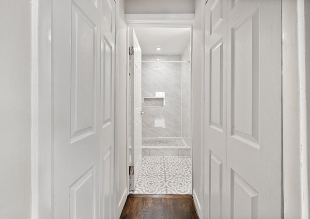 interior space with wood-type flooring and walk in shower