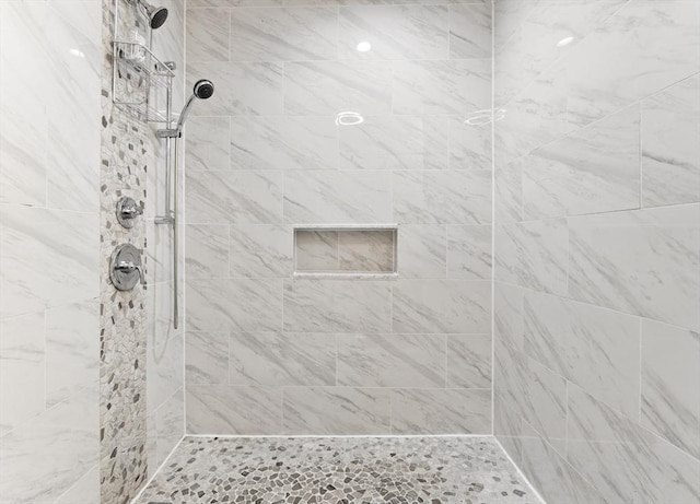 bathroom featuring tiled shower