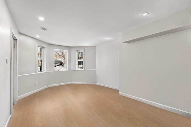 unfurnished room with light hardwood / wood-style floors