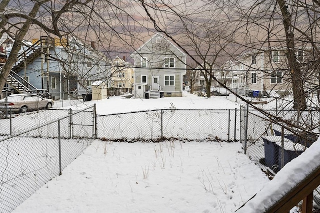 view of yard layered in snow