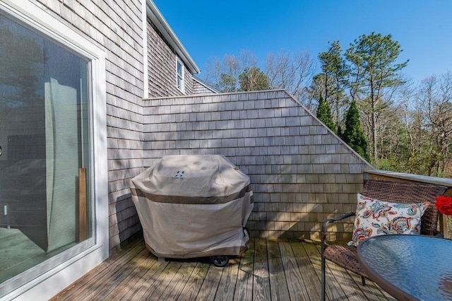 wooden terrace featuring grilling area