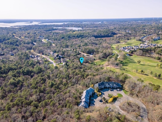 birds eye view of property featuring a view of trees
