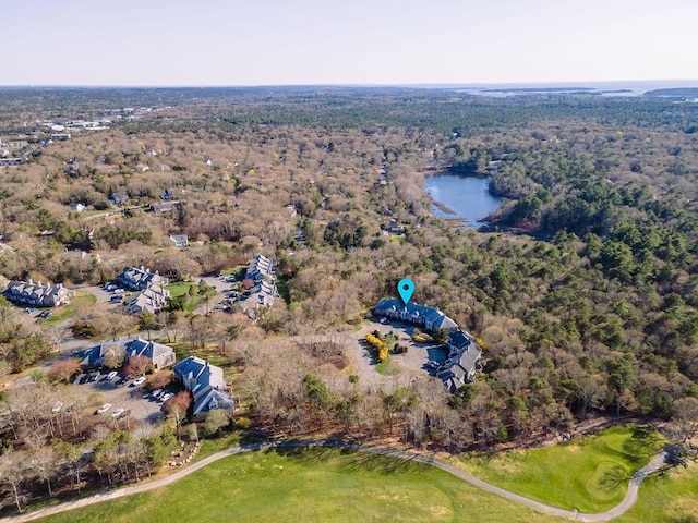 drone / aerial view featuring a forest view
