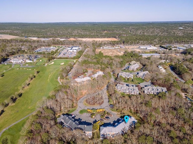 birds eye view of property with view of golf course