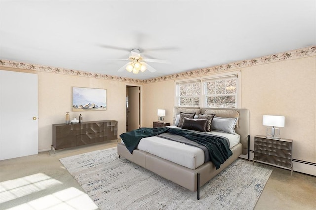 bedroom with ceiling fan and carpet flooring