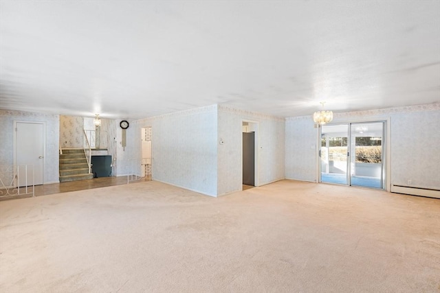 unfurnished living room featuring a baseboard radiator, a chandelier, and light colored carpet