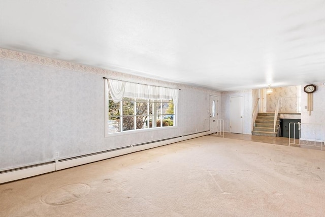 unfurnished living room featuring a baseboard radiator and carpet