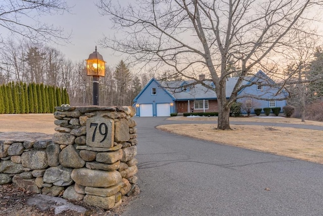 view of front of house featuring an attached garage and driveway