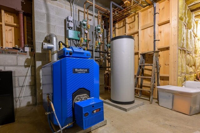 utility room with a heating unit and water heater