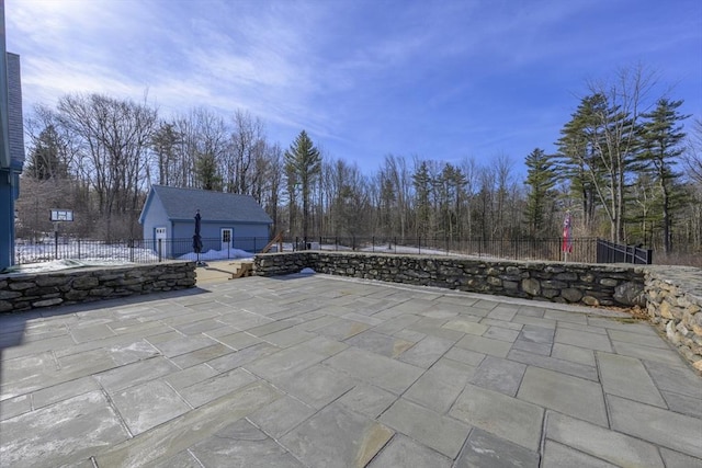 view of patio featuring a pool, an outdoor structure, and fence