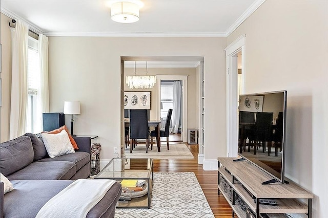8 Cambridge Ter Unit 2, Cambridge, MA 02140 - living area featuring a chandelier, crown molding, dark wood-style floors, and baseboards