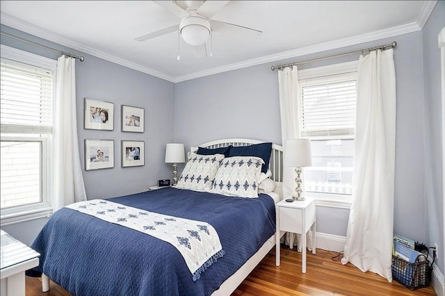 8 Cambridge Ter Unit 2, Cambridge, MA 02140 - bedroom with wood finished floors, ornamental molding, ceiling fan, and baseboards