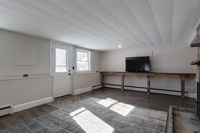 interior space with dark wood-style flooring, baseboards, and baseboard heating