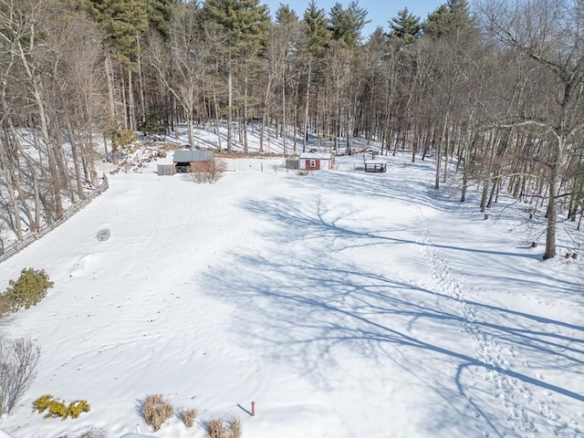 view of yard layered in snow