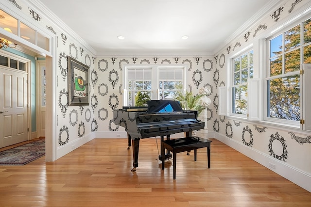 misc room with crown molding and light hardwood / wood-style flooring