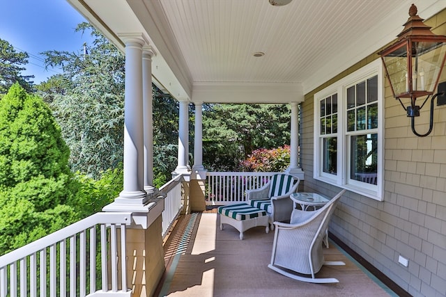 balcony featuring a porch