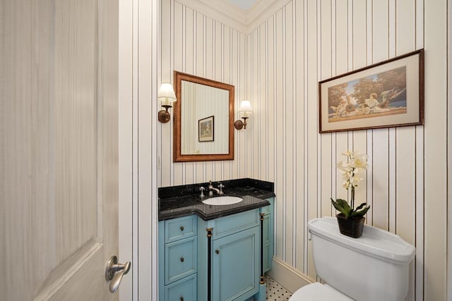 bathroom with toilet, ornamental molding, tile floors, and oversized vanity