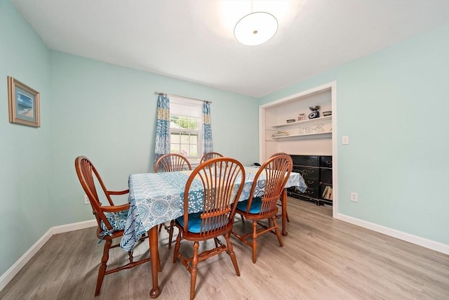 11 Brunswick St, Marshfield, MA 02050 - dining room with light wood-style floors and baseboards