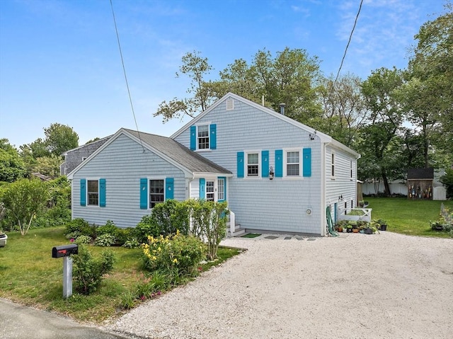 11 Brunswick St, Marshfield, MA 02050 - view of front of home with driveway and a front yard