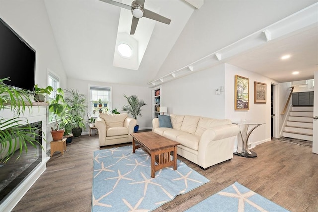 11 Brunswick St, Marshfield, MA 02050 - living room with stairway, a ceiling fan, baseboards, high vaulted ceiling, and wood finished floors