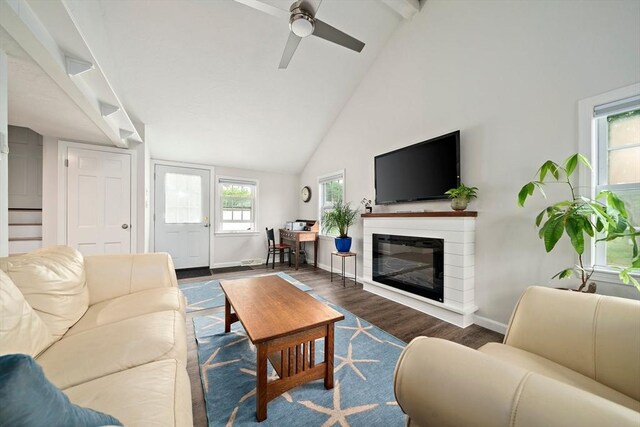 11 Brunswick St, Marshfield, MA 02050 - living room featuring baseboards, high vaulted ceiling, a ceiling fan, a glass covered fireplace, and wood finished floors