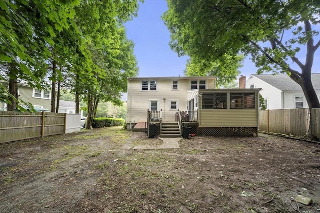 5 Cranmore, Boston, MA 02136 - rear view of house with a sunroom, a deck, a fenced backyard, and a chimney