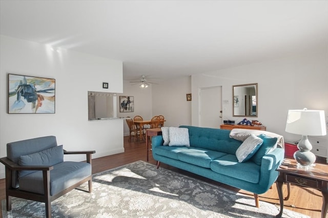 living room with hardwood / wood-style flooring and ceiling fan