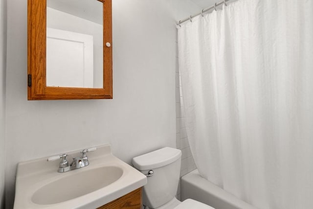 bathroom with toilet, shower / bath combination with curtain, and vanity
