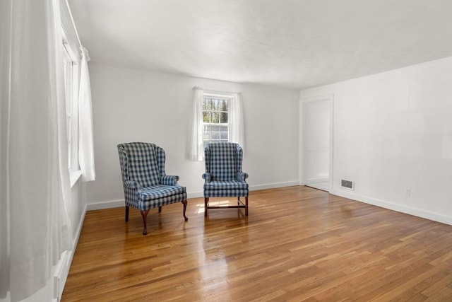 sitting room featuring light wood-style floors and baseboards