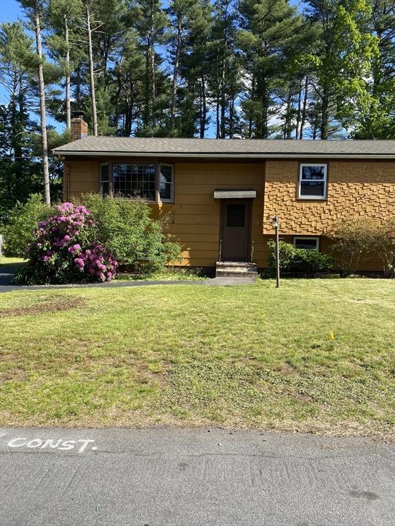 62 Duncan Rd, Stoughton, MA 02072 - view of front facade with a chimney, a front lawn, and entry steps