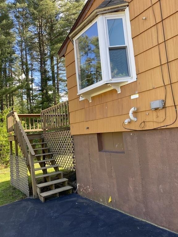 62 Duncan Rd, Stoughton, MA 02072 - view of home's exterior with stairway and a deck