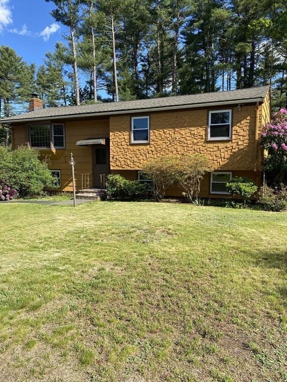 62 Duncan Rd, Stoughton, MA 02072 - split foyer home with a chimney and a front lawn