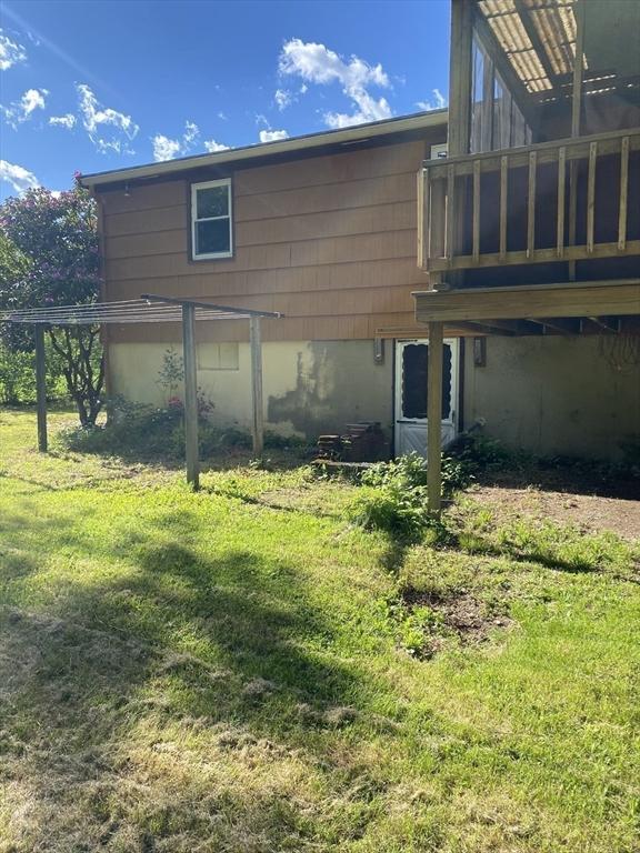 62 Duncan Rd, Stoughton, MA 02072 - back of house featuring a yard and a wooden deck