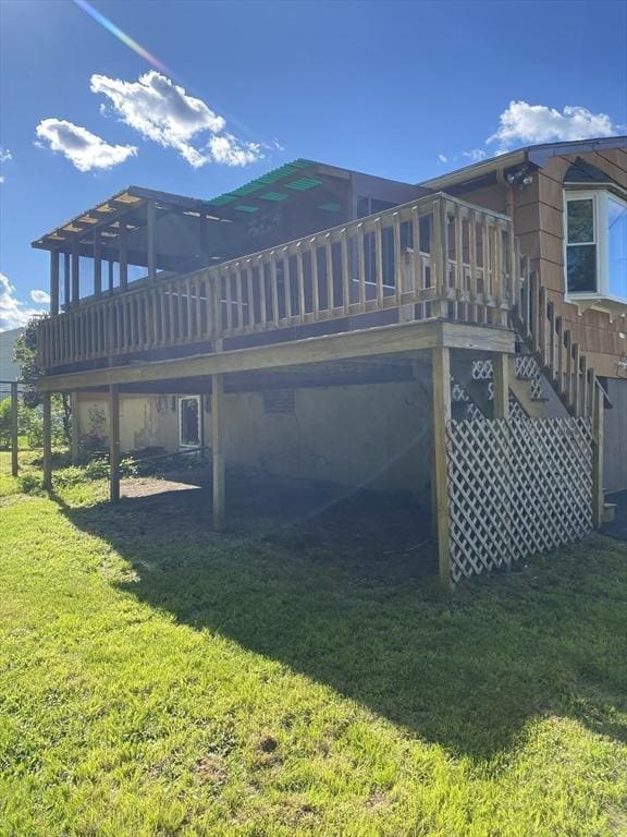 62 Duncan Rd, Stoughton, MA 02072 - back of house featuring a wooden deck, a lawn, and stairs