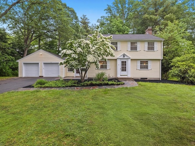 51 Quaboag Rd, Acton, MA 01720 - view of front of property with a chimney, a garage, a front lawn, and asphalt driveway