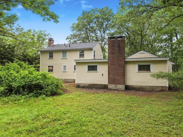51 Quaboag Rd, Acton, MA 01720 - back of house featuring a chimney and a yard