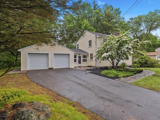 51 Quaboag Rd, Acton, MA 01720 - view of front of house featuring asphalt driveway and a garage