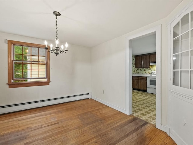 51 Quaboag Rd, Acton, MA 01720 - unfurnished room featuring a chandelier, light wood-type flooring, and baseboard heating